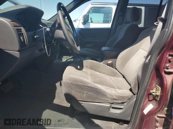 2000 Jeep Grand Cherokee Laredo with VIN 1J4G248S1YC407769, listed as a Copart auction lot 61653545 with 188,882 mi miles and Salvage title. Bid and sale history available at DreamBid. Image 7.