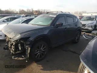 2021 Mazda CX-5 Signature with VIN JM3KFBEY2M0345187, listed as a Copart auction lot 82786984 with 98,014 mi miles and Salvage Title. Bid and sale history available at carsss.com. Image 1.