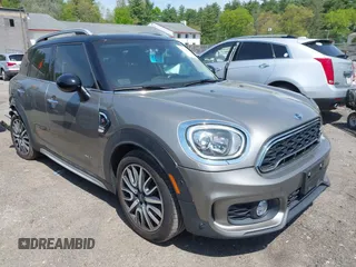 2017 MINI Countryman Cooper S z VIN WMZYT5C33H3D79148, wystawiony jako IAAI lot #42225781 z przebiegiem 95 023 mil mil oraz . Historia ofert i sprzedaży dostępna na DreamBid. Obrazek 1.