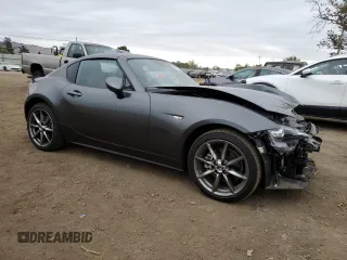 2022 Mazda MX-5 Miata Grand Touring z VIN JM1NDAM77N0501546, wystawiony jako Copart lot #82161264 z przebiegiem 12 245 mil mil oraz Szkoda całkowita • Salvage title. Historia ofert i sprzedaży dostępna na DreamBid. Obrazek 4.