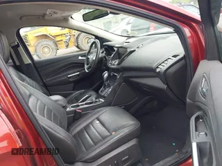 2015 Ford Escape Titanium z VIN 1FMCU9J98FUC84963, wystawiony jako IAAI lot #42469112 z przebiegiem 128 838 mil mil oraz . Historia ofert i sprzedaży dostępna na DreamBid. Obrazek 5.
