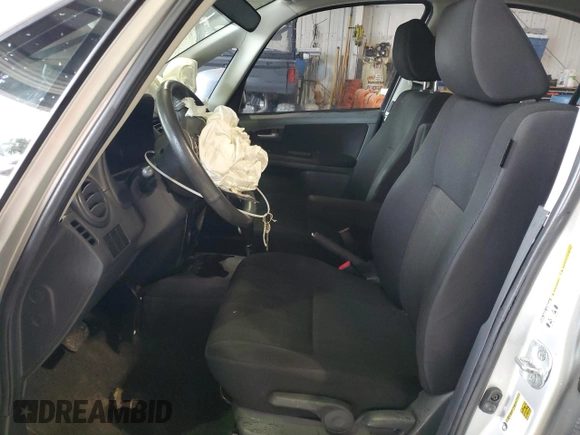 2012 Suzuki SX4 LE z VIN JS2YC5A34C6304150, wystawiony jako Copart lot #48629255 z przebiegiem 104 658 mil mil oraz Szkoda całkowita • Salvage title. Historia ofert i sprzedaży dostępna na DreamBid. Obrazek 7.