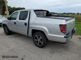 2014 Honda Ridgeline Sport with VIN 5FPYK1F76EB005713, listed as a Copart auction lot 74694724 with 73,039 mi miles and Salvage Title. Bid and sale history available at carsss.com. Image 2.