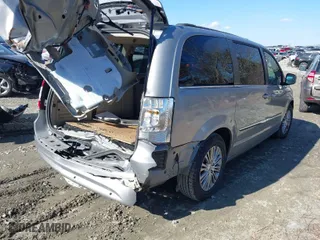 2014 Chrysler Town & Country Touring-L 30th Anniversary with VIN 2C4RC1CG0ER179943, listed as a IAAI auction lot 41420688 with 238,340 mi miles. Bid and sale history available at carsss.com. Image 4.