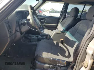 2001 Jeep Cherokee Sport z VIN 1J4FF58S61L540796, wystawiony jako Copart lot #62384895 z przebiegiem 209 294 mil mil oraz Czysty tytuł • Clean title. Historia ofert i sprzedaży dostępna na DreamBid. Obrazek 7.