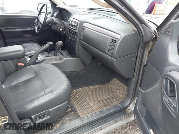 2002 Jeep Grand Cherokee with VIN 1J4GW38N62C190851, listed as a IAAI auction lot 42519384 with 142,066 mi miles and . Bid and sale history available at DreamBid. Image 5.