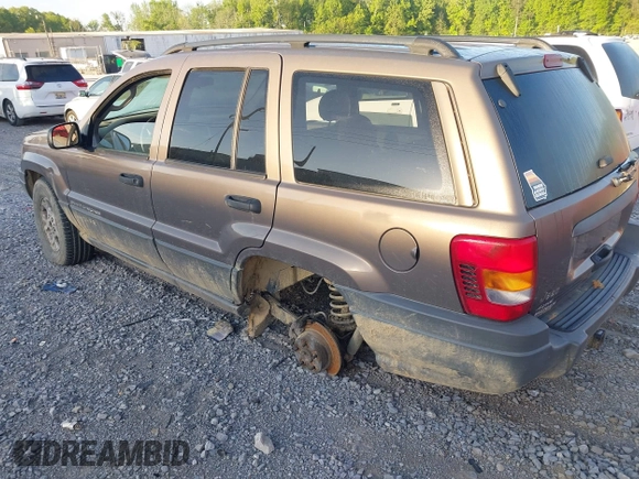 2002 Jeep Grand Cherokee with VIN 1J4GW38N42C202219, listed as a IAAI auction lot 42035162 with 220,012 mi miles and . Bid and sale history available at DreamBid. Image 3.