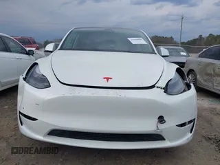 2023 Tesla Model Y Long Range with VIN 7SAYGDEE2PF765395, listed as a IAAI auction lot 41688080 with 27,792 mi miles and . Bid and sale history available at DreamBid. Image 12.