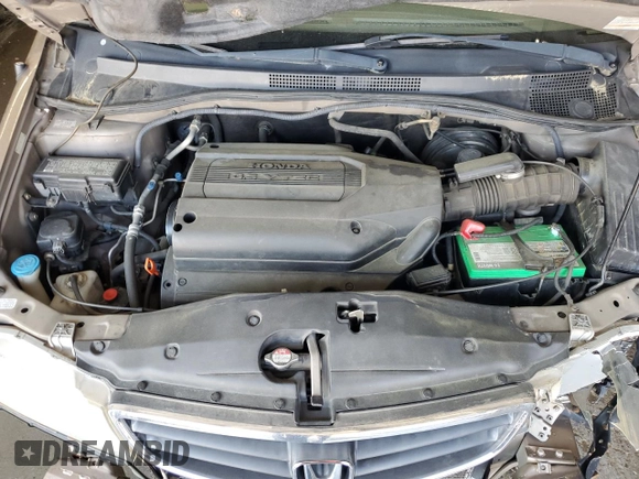 2004 Honda Odyssey LX z VIN 5FNRL18554B007005, wystawiony jako Copart lot #54377345 z przebiegiem 219 655 mil mil oraz Szkoda całkowita • Salvage title. Historia ofert i sprzedaży dostępna na DreamBid. Obrazek 12.