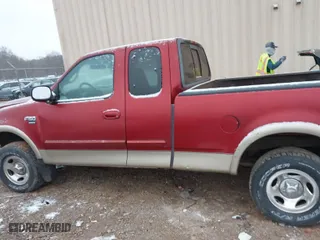 2000 Ford F-150 XL with VIN 1FTRX18L6YNA92785, listed as a IAAI auction lot 41618404 with 136,991 mi miles. Bid and sale history available at carsss.com. Image 14.