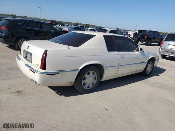 2000 Cadillac Eldorado with VIN 1G6EL12Y0YB702117, listed as a Copart auction lot 80297854 with 124,851 mi miles and Salvage Title. Bid and sale history available at carsss.com. Image 3.
