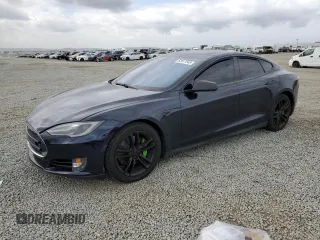 2013 Tesla Model S Performance with VIN 5YJSA1DP9DFP05325, listed as a Copart auction lot 52617545 with 122,847 mi miles and Salvage title. Bid and sale history available at DreamBid. Image 1.