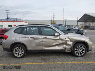 2015 BMW X1 xDrive28i with VIN WBAVL1C55FVY41749, listed as a IAAI auction lot 40977221 with 120,924 mi miles. Bid and sale history available at carsss.com. Image 13.