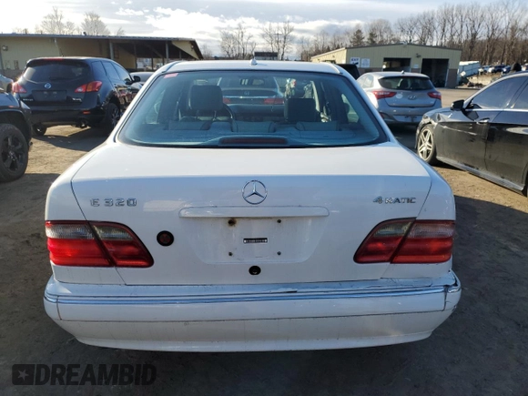 2000 Mercedes-Benz E-Class AWD with VIN WDBJF82G1YX028712, listed as a Copart auction lot 43983315 with 201,037 mi miles and Salvage Title. Bid and sale history available at carsss.com. Image 6.