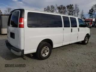 2014 Chevrolet Express Passenger LT with VIN 1GAZG1FG2E1202457, listed as a Copart auction lot 82704884 with 142,982 mi miles and Salvage title. Bid and sale history available at DreamBid. Image 3.