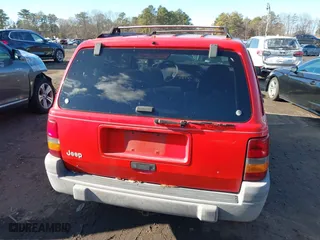 1997 Jeep Grand Cherokee Laredo with VIN 1J4GZ58S0VC550242, listed as a IAAI auction lot 41032114 with 185,307 mi miles. Bid and sale history available at carsss.com. Image 16.