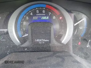2010 Honda Insight EX with VIN JHMZE2H71AS017996, listed as a IAAI auction lot 42091356 with 142,474 mi miles and . Bid and sale history available at DreamBid. Image 15.