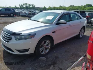 2014 Ford Taurus SEL with VIN 1FAHP2E84EG141795, listed as a IAAI auction lot 42133668 with 154,009 mi miles and . Bid and sale history available at DreamBid. Image 2.
