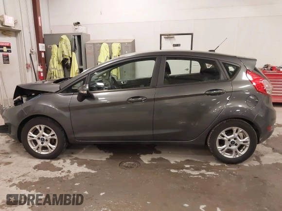 2015 Ford Fiesta SE z VIN 3FADP4EJ8FM138306, wystawiony jako IAAI lot #41227124 z przebiegiem 106 741 mil mil oraz . Historia ofert i sprzedaży dostępna na DreamBid. Obrazek 14.