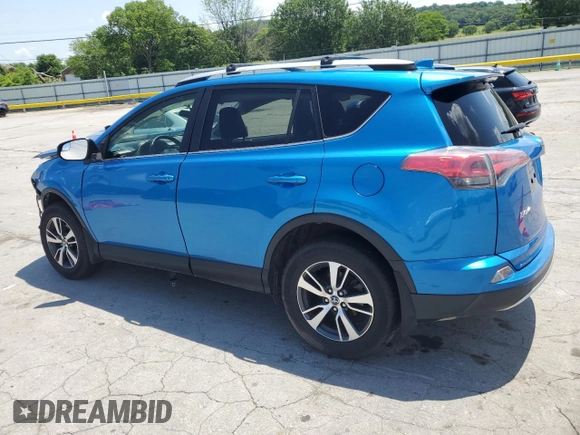 2016 Toyota RAV4 XLE with VIN JTMRFREV2GJ058808, listed as a Copart auction lot 61449135 with 73,985 mi miles and Salvage title. Bid and sale history available at DreamBid. Image 2.