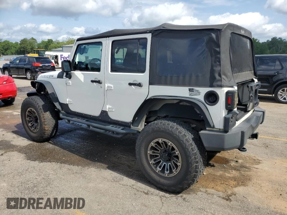 2010 Jeep Wrangler Unlimited Rubicon with VIN 1J4BA6H10AL176014, listed as a Copart auction lot 57092255 with 138,253 mi miles and Salvage title. Bid and sale history available at DreamBid. Image 2.