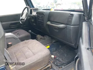 2002 Jeep Wrangler X z VIN 1J4FA39S82P735794, wystawiony jako IAAI lot #42411386 z przebiegiem 141 219 mil mil oraz . Historia ofert i sprzedaży dostępna na DreamBid. Obrazek 5.
