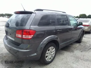 2018 Dodge Journey SE with VIN 3C4PDCAB4JT296083, listed as a IAAI auction lot 41976090 with 63,051 mi miles and . Bid and sale history available at DreamBid. Image 4.