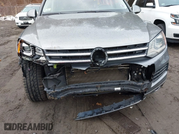 2013 Volkswagen Touareg Lux with VIN WVGEF9BP0DD005082, listed as a IAAI auction lot 41667026 with 140,148 mi miles and . Bid and sale history available at DreamBid. Image 6.