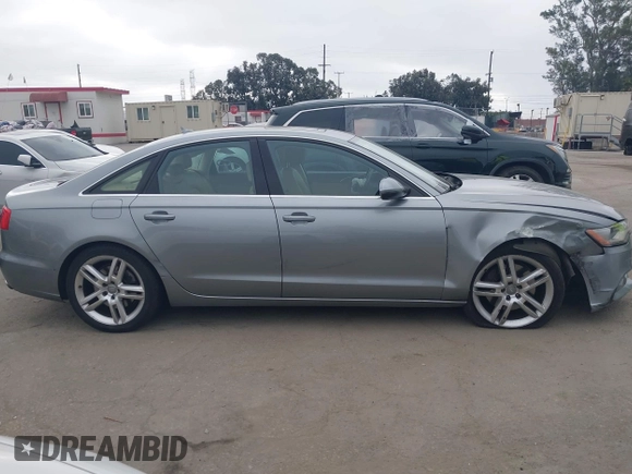 2015 Audi A6 Premium Plus z VIN WAUGFAFC6FN009203, wystawiony jako IAAI lot #42242726 z przebiegiem 69 163 mil mil oraz . Historia ofert i sprzedaży dostępna na DreamBid. Obrazek 13.