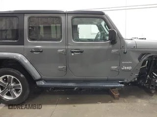 2019 Jeep Wrangler Unlimited Sahara with VIN 1C4HJXEG9KW656454, listed as a IAAI auction lot 41648236 with 75,403 mi miles and . Bid and sale history available at DreamBid. Image 14.