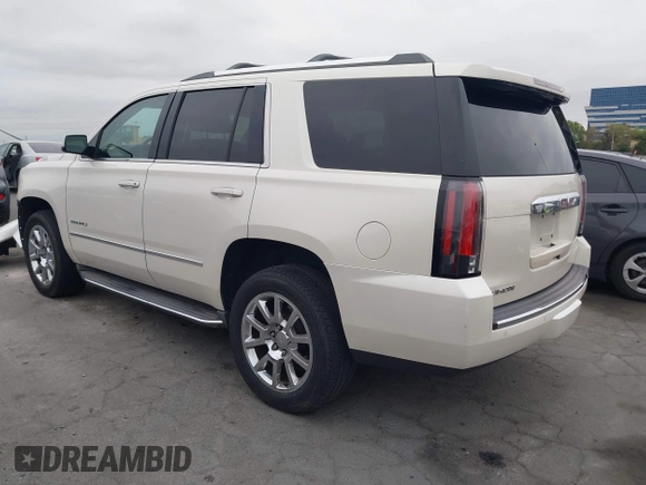 2015 GMC Yukon Denali with VIN 1GKS2CKJ9FR294551, listed as a IAAI auction lot 42162654 with 106,063 mi miles. Bid and sale history available at carsss.com. Image 3.
