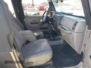 2005 Jeep Wrangler Sport with VIN 1J4FA49S65P342497, listed as a IAAI auction lot 41674606 with 123,457 mi miles. Bid and sale history available at carsss.com. Image 5.