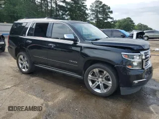 2016 Chevrolet Tahoe LTZ with VIN 1GNSCCKCXGR264655, listed as a Copart auction lot 57456625 with 237,621 mi miles and Salvage title. Bid and sale history available at DreamBid. Image 4.