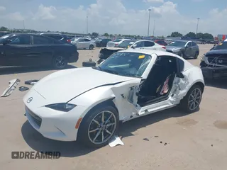 2021 Mazda MX-5 Miata Grand Touring z VIN JM1NDAM71M0457011, wystawiony jako IAAI lot #42427652 z przebiegiem 4 045 mil mil oraz . Historia ofert i sprzedaży dostępna na DreamBid. Obrazek 18.