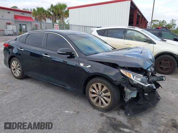 2018 Kia Optima LX z VIN 5XXGT4L33JG270472, wystawiony jako IAAI lot #42292416 z przebiegiem 60 064 mil mil oraz . Historia ofert i sprzedaży dostępna na DreamBid. Obrazek 1.