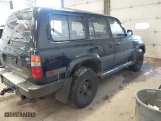 1997 Toyota Land Cruiser with VIN JT3HJ85J1V0184599, listed as a IAAI auction lot 41571386 with 305,201 mi miles. Bid and sale history available at carsss.com. Image 4.