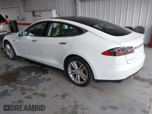 2014 Tesla Model S 60 with VIN 5YJSA1S16EFP53350, listed as a IAAI auction lot 42239753 with 104,985 mi miles and . Bid and sale history available at DreamBid. Image 3.