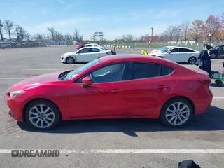 2014 Mazda 3 S Grand Touring with VIN JM1BM1W32E1107542, listed as a IAAI auction lot 42070484 with 132,395 mi miles and . Bid and sale history available at DreamBid. Image 14.