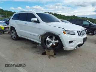2016 Jeep Grand Cherokee Overland with VIN 1C4RJFCG2GC490420, listed as a IAAI auction lot 42200700 with 97,007 mi miles and . Bid and sale history available at DreamBid. Image 1.
