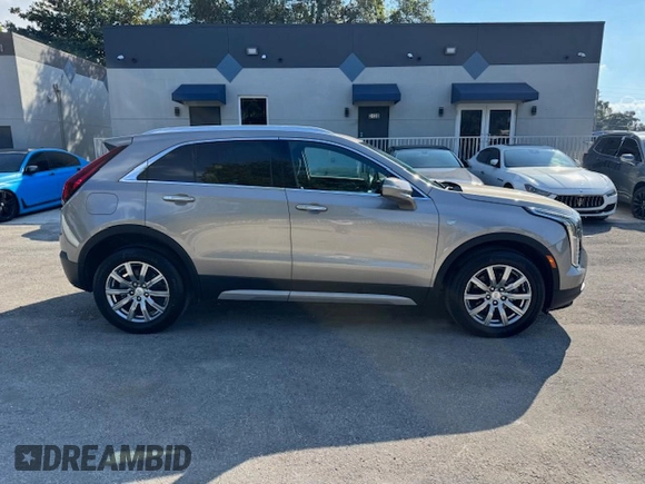 2023 Cadillac XT4 AWD Premium Luxury z VIN 1GYFZDR40PF108407, wystawiony jako Copart lot #86400754 z przebiegiem 8 724 mil mil oraz Nie do naprawy • Non repairable. Historia ofert i sprzedaży dostępna na DreamBid. Obrazek 13.