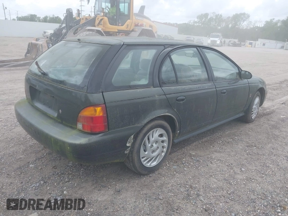 1999 Saturn SW z VIN 1G8ZK8271XZ314797, wystawiony jako IAAI lot #41843385 z przebiegiem 91 599 mil mil oraz . Historia ofert i sprzedaży dostępna na DreamBid. Obrazek 4.