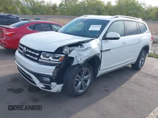 2018 Volkswagen Atlas SE z VIN 1V2FR2CA2JC540657, wystawiony jako IAAI lot #42115554 z przebiegiem 107 309 mil mil oraz . Historia ofert i sprzedaży dostępna na DreamBid. Obrazek 17.