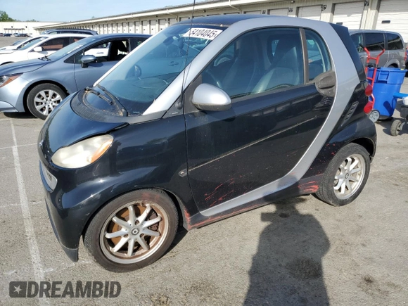2009 Smart fortwo Pure z VIN WMEEJ31X39K211342, wystawiony jako Copart lot #54104045 z przebiegiem 46 162 mil mil oraz Tytuł czysty. Historia ofert i sprzedaży dostępna na DreamBid. Obrazek 1.