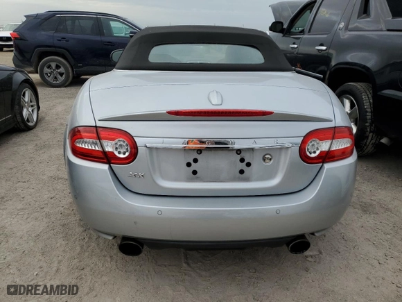 2010 Jaguar XK with VIN SAJWA4GB7ALB35518, listed as a Copart auction lot 74672434 with 0 mi miles and Salvage Title. Bid and sale history available at carsss.com. Image 6.