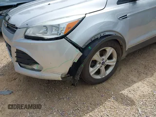 2014 Ford Escape SE with VIN 1FMCU9GX9EUB15619, listed as a IAAI auction lot 42603542 with 188,454 mi miles and . Bid and sale history available at DreamBid. Image 6.
