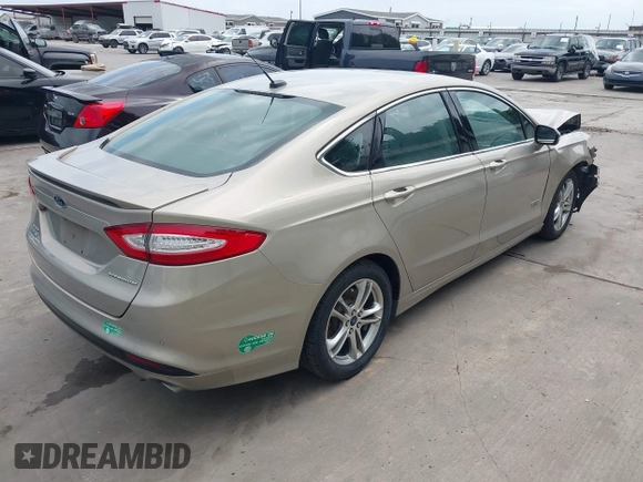 2015 Ford Fusion Energi Titanium with VIN 3FA6P0SU3FR114739, listed as a IAAI auction lot 42003011 with 120,553 mi miles. Bid and sale history available at carsss.com. Image 4.