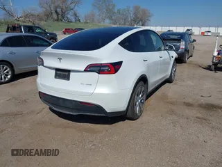 2021 Tesla Model Y Long Range with VIN 5YJYGDEE4MF122362, listed as a IAAI auction lot 42096138 with 47,006 mi miles and . Bid and sale history available at DreamBid. Image 4.