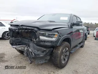 2019 Ram 1500 Rebel z VIN 1C6SRFLT1KN722064, wystawiony jako IAAI lot #41513201 z przebiegiem 113 559 mil mil oraz . Historia ofert i sprzedaży dostępna na DreamBid. Obrazek 23.
