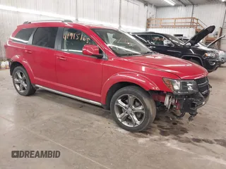 2016 Dodge Journey Crossroad Plus z VIN 3C4PDDGGXGT245673, wystawiony jako IAAI lot #41915165 z przebiegiem 124 861 mil mil oraz . Historia ofert i sprzedaży dostępna na DreamBid. Obrazek 1.