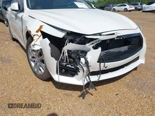 2015 Infiniti Q50 Premium z VIN JN1BV7AP9FM331131, wystawiony jako IAAI lot #41786108 z przebiegiem 176 874 mil mil oraz . Historia ofert i sprzedaży dostępna na DreamBid. Obrazek 6.